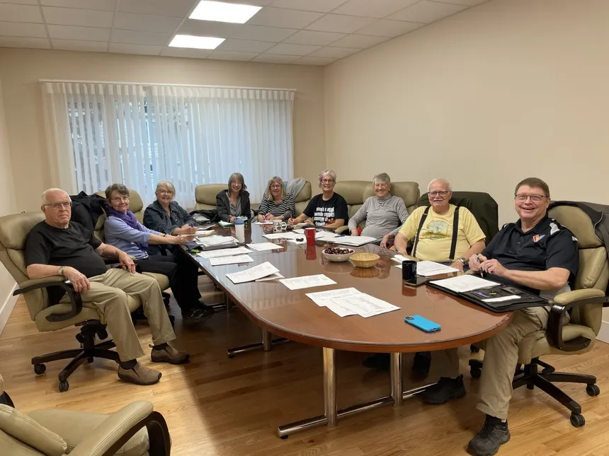 The Board of Directors around the boardroom table