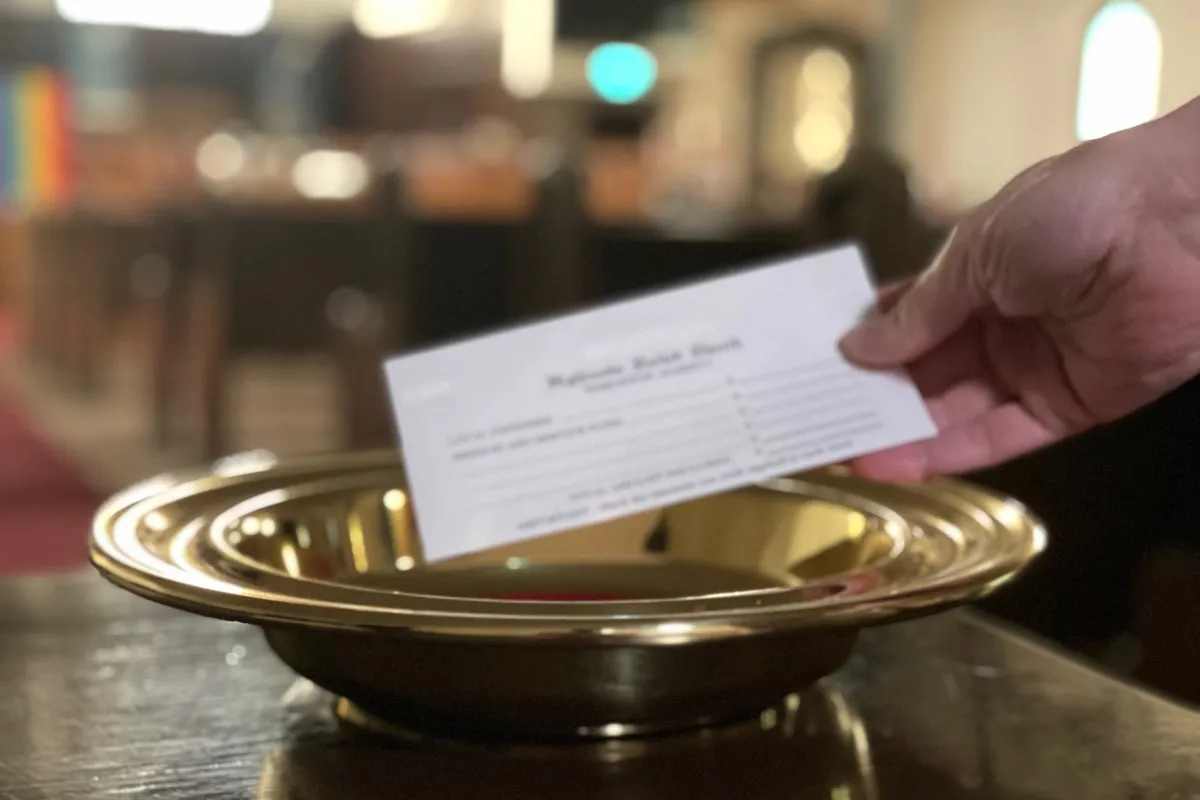 The offering plate resting on the communion table