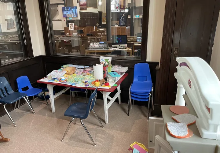 The Shepherd's Den busy space in the sanctuary: a small table with toys and child-sized chairs