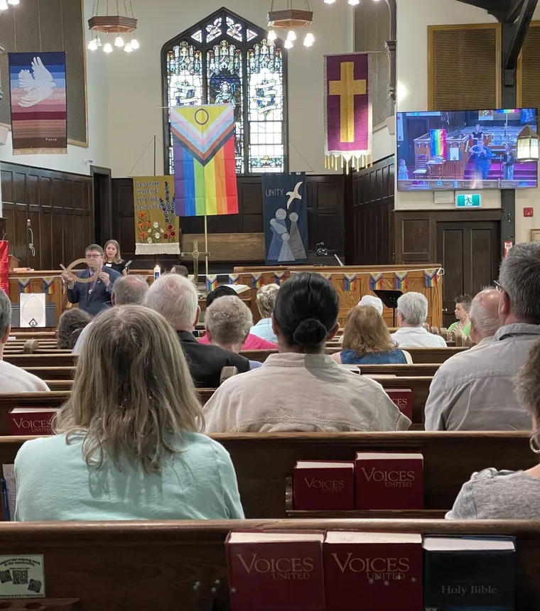 The congregation in the pews on a Sunday morning, facing the chancel and its screens